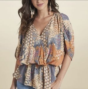 Beautiful peplum top mixed print oversized fit. 1xl